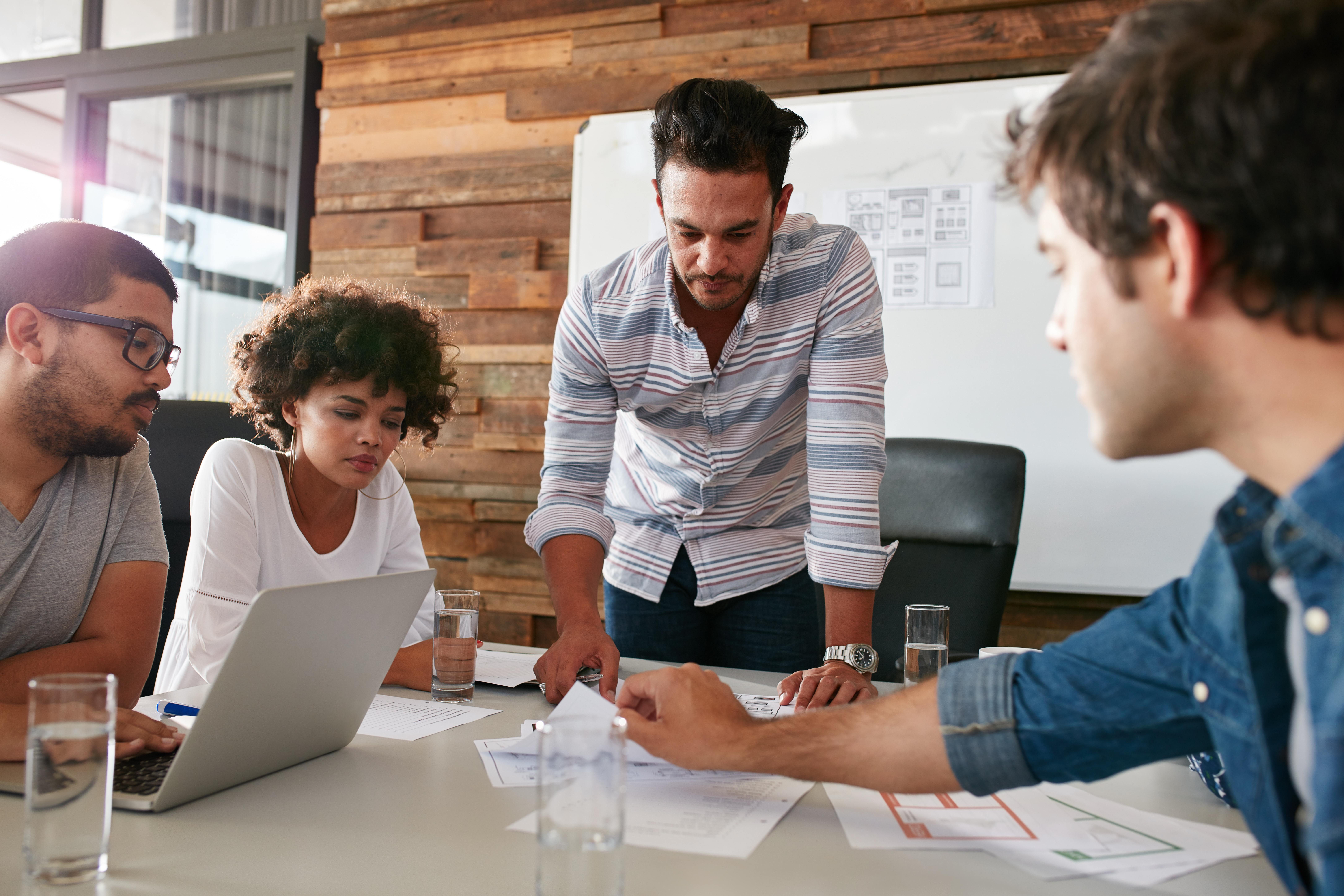 Marketing meeting between four business people